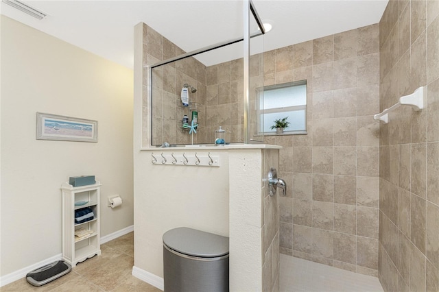 full bathroom featuring tile patterned flooring, visible vents, baseboards, and walk in shower