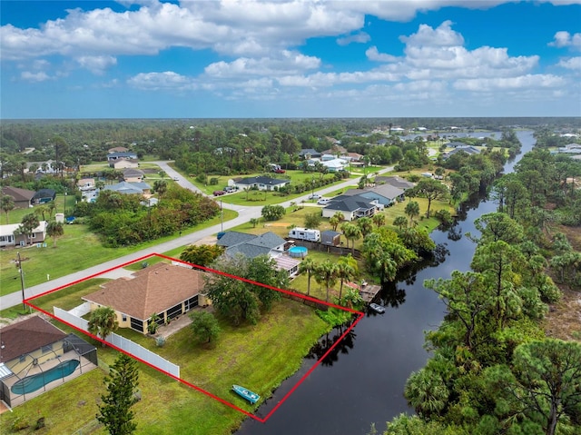 aerial view with a water view and a residential view