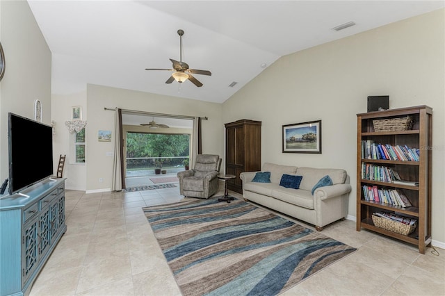 living room featuring light tile patterned floors, visible vents, baseboards, and lofted ceiling