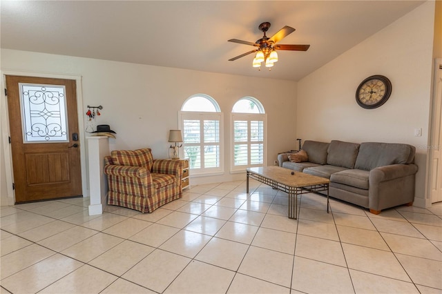 tiled living room featuring ceiling fan and lofted ceiling