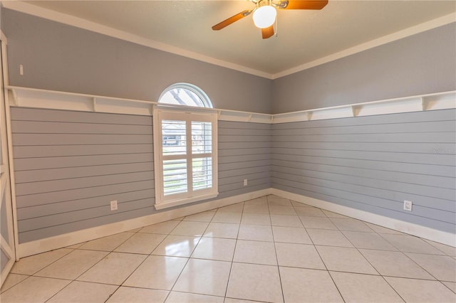 spare room with light tile patterned floors, ceiling fan, and lofted ceiling