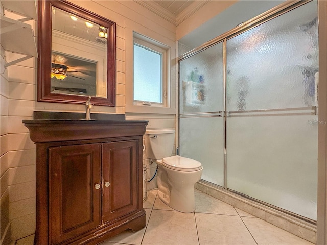 bathroom with tile patterned floors, walk in shower, vanity, crown molding, and toilet