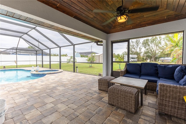 exterior space featuring an outdoor living space, a pool with hot tub, a lanai, and ceiling fan