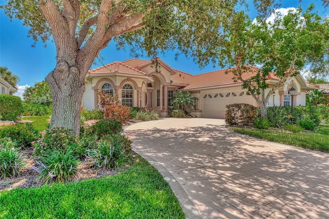 mediterranean / spanish-style house featuring a garage