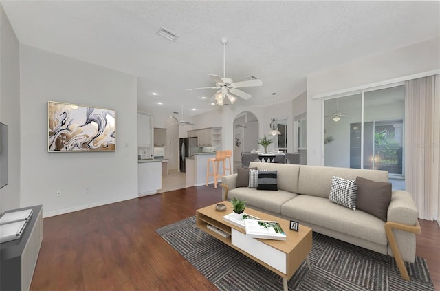 living room with hardwood / wood-style floors and a textured ceiling