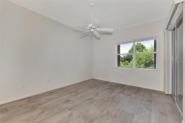 spare room with ceiling fan and light hardwood / wood-style flooring