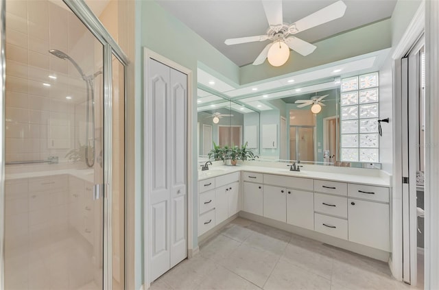 bathroom with tile patterned flooring, vanity, ceiling fan, and a shower with shower door