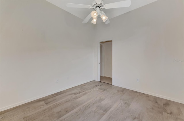 empty room featuring ceiling fan and light hardwood / wood-style floors