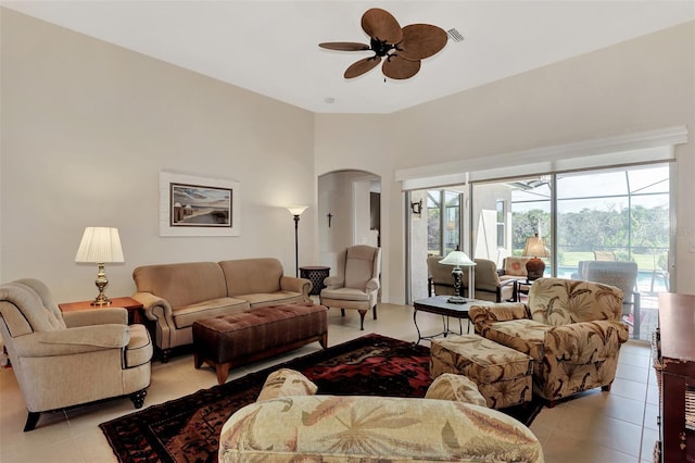 tiled living room with ceiling fan