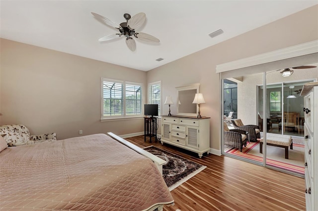 bedroom with hardwood / wood-style flooring and ceiling fan