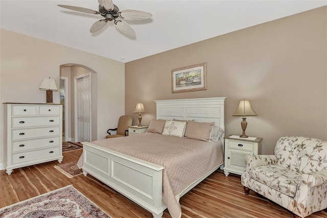 bedroom featuring a closet, hardwood / wood-style flooring, and ceiling fan