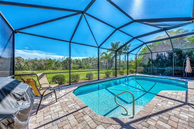 view of pool featuring a patio, a lanai, and a grill