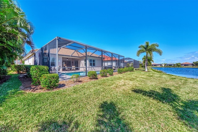 view of yard featuring a water view and a lanai