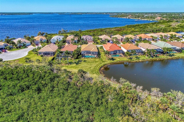 drone / aerial view with a water view