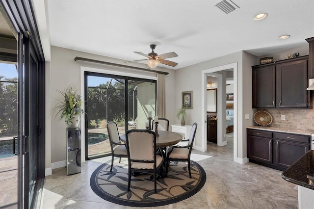 dining area featuring plenty of natural light and ceiling fan