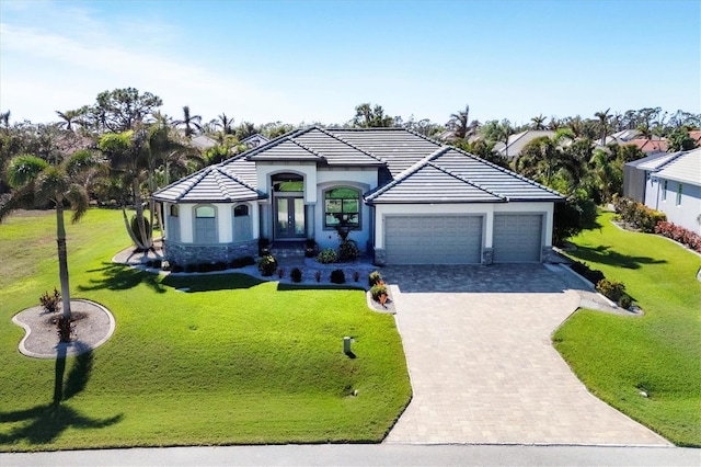 view of front facade featuring a front yard and a garage