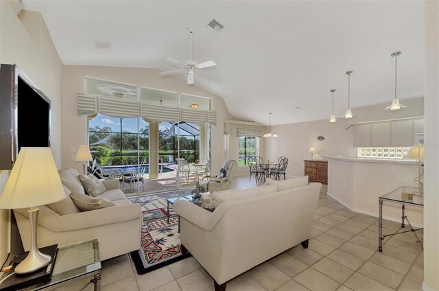 living room featuring light tile patterned floors, high vaulted ceiling, and ceiling fan