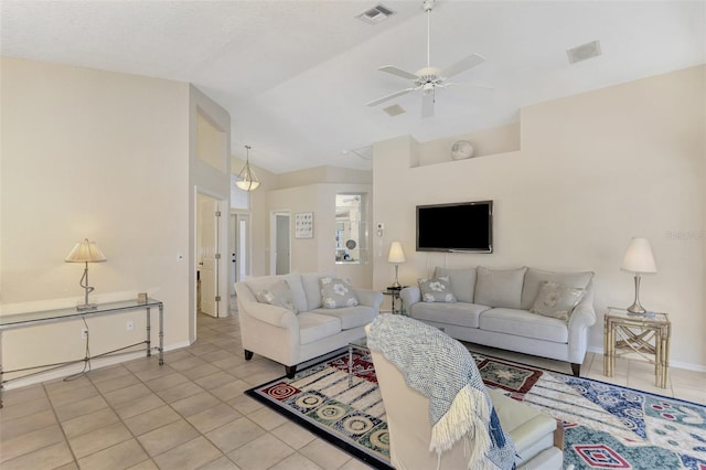 tiled living room featuring ceiling fan and lofted ceiling