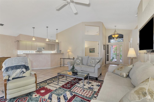 living room featuring ceiling fan, french doors, light tile patterned floors, and high vaulted ceiling