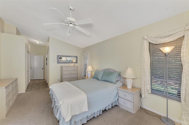 carpeted bedroom featuring vaulted ceiling and ceiling fan