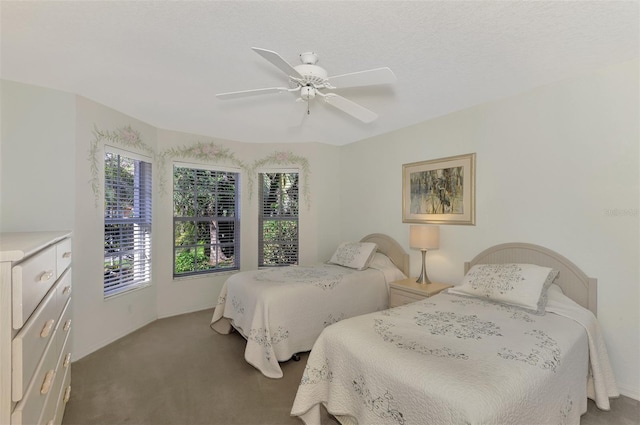 bedroom with ceiling fan and carpet floors