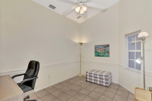 tiled home office featuring ceiling fan