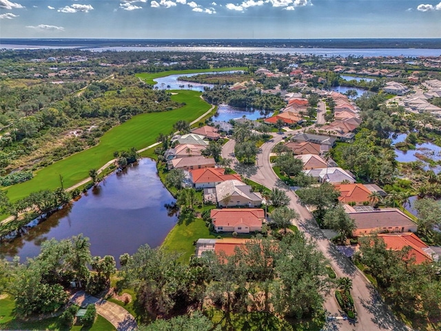 bird's eye view with a water view