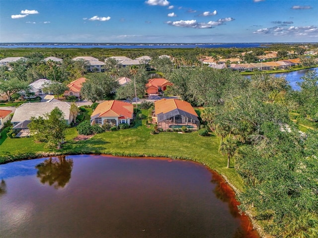 drone / aerial view with a water view