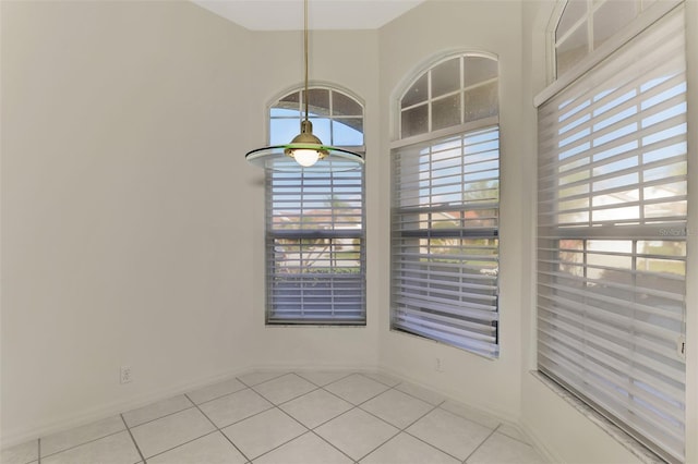 spare room with light tile patterned floors