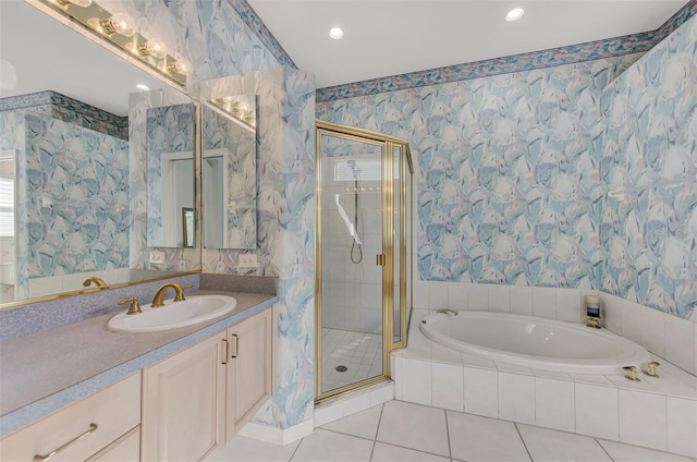 bathroom with vanity, independent shower and bath, and tile patterned flooring