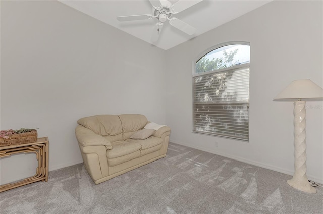 sitting room featuring ceiling fan and carpet