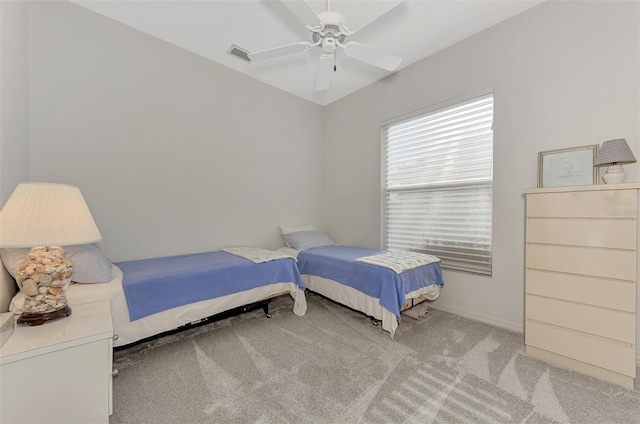 bedroom with ceiling fan and light carpet