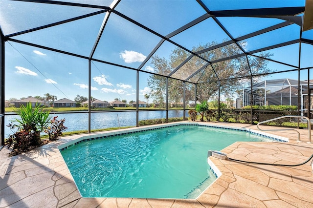 view of swimming pool featuring a lanai, a water view, and a patio area