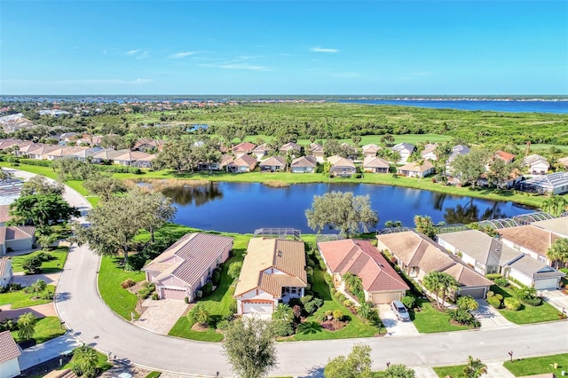 birds eye view of property with a water view