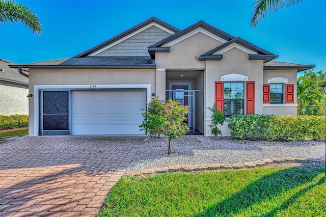 2148 La Palma Ave, Port Charlotte, FL 33953 - view of front of home featuring stucco siding, an attached garage, and decorative driveway