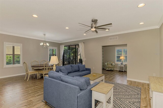 2148 La Palma Ave, Port Charlotte, FL 33953 - living area with healthy amount of natural light, wood finished floors, a chandelier, a ceiling fan, and recessed lighting