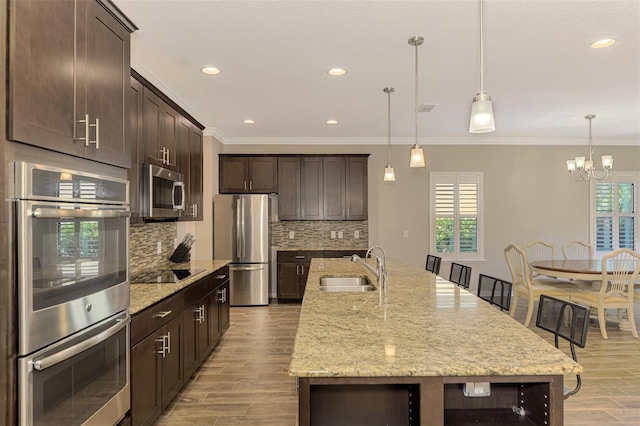 2148 La Palma Ave, Port Charlotte, FL 33953 - kitchen with appliances with stainless steel finishes, light wood-style flooring, dark brown cabinetry, backsplash, and ornamental molding