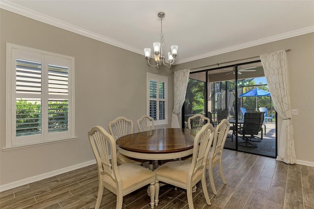 dining area with dark hardwood / wood-style flooring, an inviting chandelier, and ornamental molding