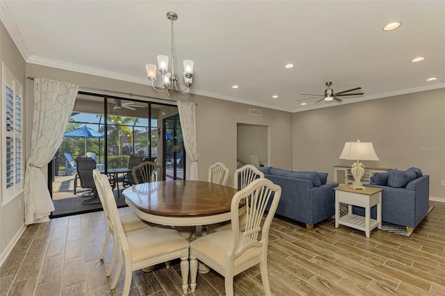 dining room with hardwood / wood-style flooring, ceiling fan with notable chandelier, and crown molding