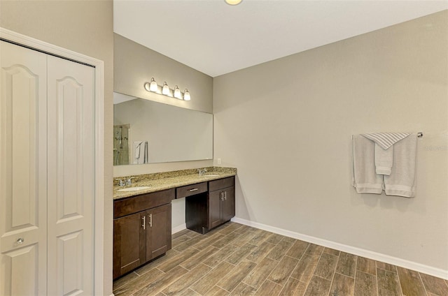 bathroom with hardwood / wood-style floors and vanity