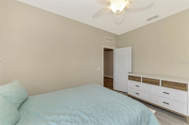 bedroom featuring ceiling fan and light hardwood / wood-style flooring