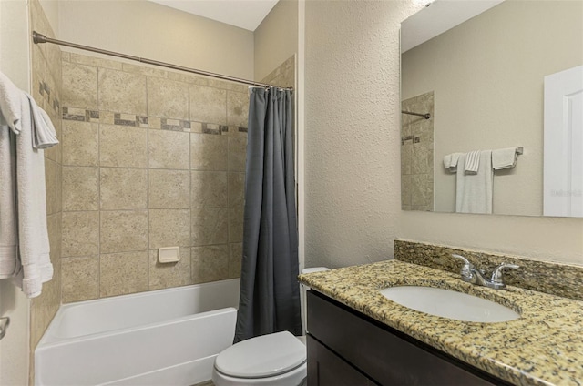 full bathroom featuring shower / bath combination with curtain, vanity, and toilet