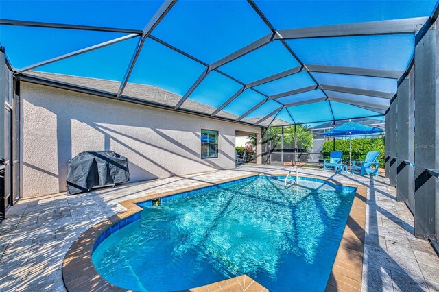 2148 La Palma Ave, Port Charlotte, FL 33953 - swimming pool featuring grilling area, a patio, and a lanai
