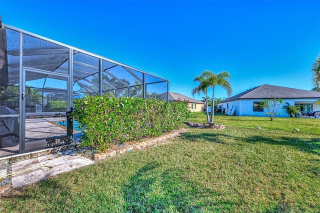 view of yard with a lanai