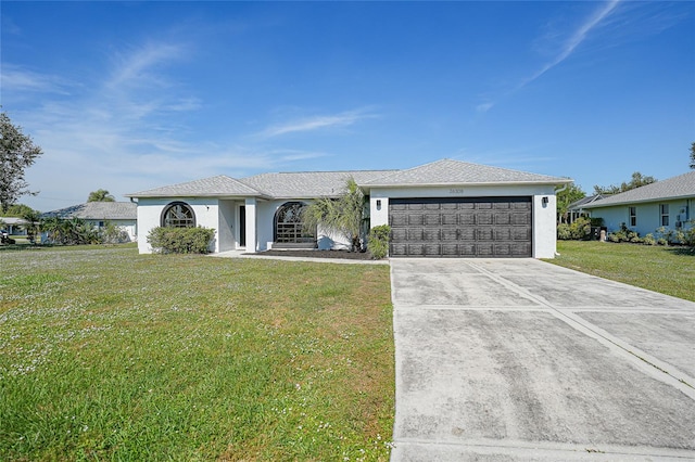 single story home featuring a front yard and a garage