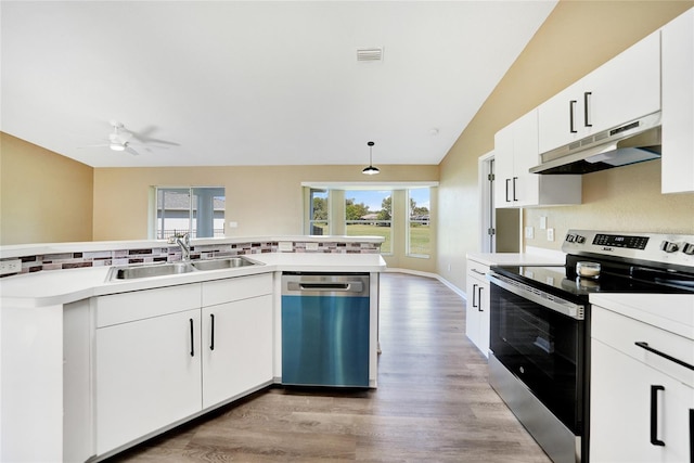 kitchen featuring sink, stainless steel appliances, hardwood / wood-style floors, lofted ceiling, and white cabinets