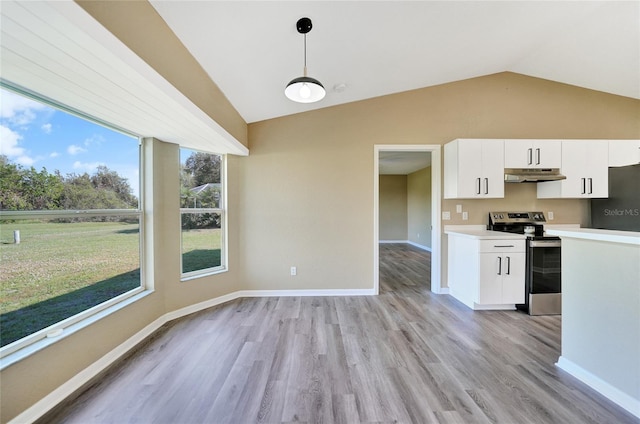 kitchen featuring vaulted ceiling, stainless steel electric stove, pendant lighting, light hardwood / wood-style floors, and white cabinetry