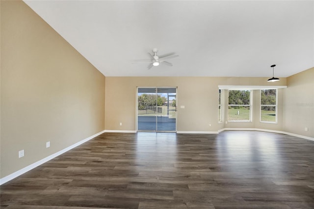 unfurnished living room with dark hardwood / wood-style floors, ceiling fan, and lofted ceiling