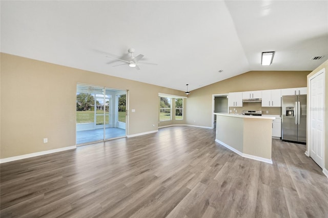 unfurnished living room with ceiling fan, light hardwood / wood-style floors, and lofted ceiling