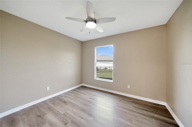 unfurnished room with ceiling fan and light hardwood / wood-style floors